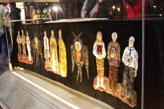 The richly embroidered funeral pall features citizens of the city from the time of Richard to the present day,